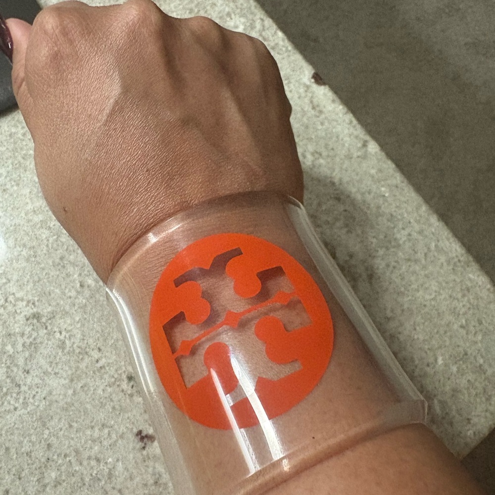 Tory Burch Transparent Cuff with Vibrant Orange Logo